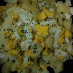 A picture of Potatoes and eggs salad.