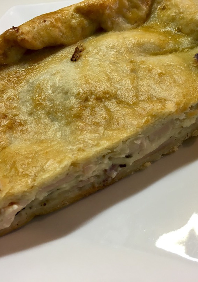 Una foto de Empanada de pollo especiado con bechamel