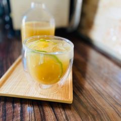 A picture of Sugarcane juice with ginger and lime/lemon juice.
