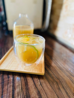 A picture of Sugarcane juice with ginger and lime/lemon juice.