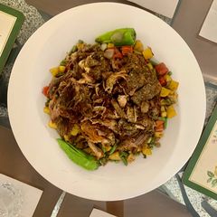 A picture of Mutton Raan (leg) roast with the bed of veggies.