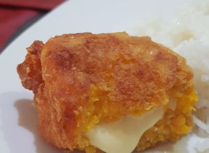 Una foto de Fritos de zapallo rellenos con queso