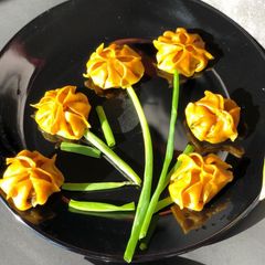 A picture of Garlic Momo/ dumplings (Sunflower shapes).