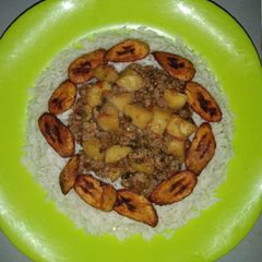 White rice and plantain with minced meat sauce A picture of White rice and plantain with minced meat sauce.