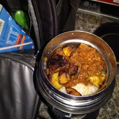 A picture of Rice and tomato gravy.