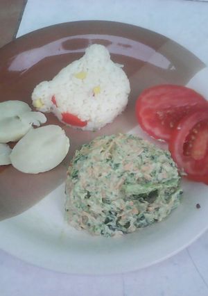 A picture of Green cabbage leaves and carrots salad.
