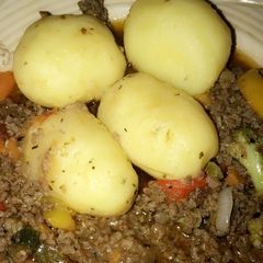 A picture of Boiled potatoes and minced meat sauce. Yes.
