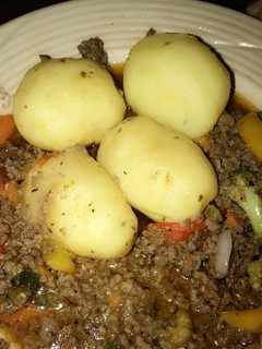 A picture of Boiled potatoes and minced meat sauce. Yes.