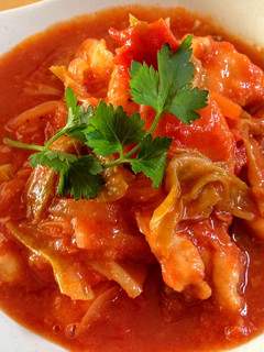 A picture of Chicken Cooked in Tomato.