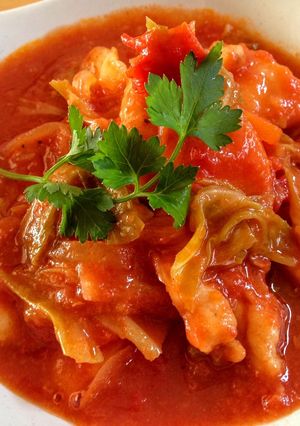 A picture of Chicken Cooked in Tomato.