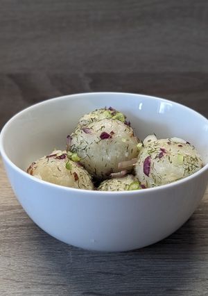 A picture of Pierogi with Sour Cream.