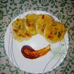 A picture of Mixed Mini Uttapam with tangy tamarind sauce.