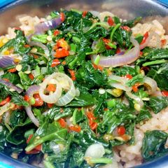 A picture of Veggies with jollof rice.