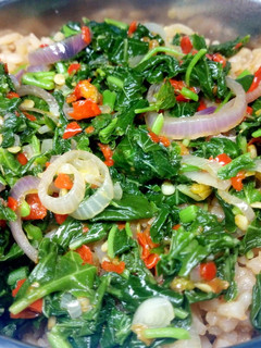 A picture of Veggies with jollof rice.