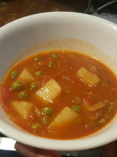A picture of Indian potato greenpeas mushroom gravy.