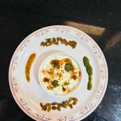 A picture of Raisins Filled Dahi vada.