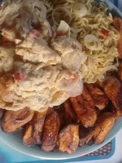 A picture of Indomine with Fried plantain,fried eggs.