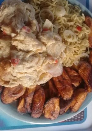 A picture of Indomine with Fried plantain,fried eggs.