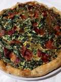 Quiche con rucola e speck