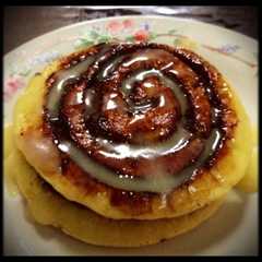 A picture of Cinnamon Rolls Pancakes with Cream Cheese Glaze.