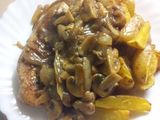 Turkey Steak Served with Potato Wedges and Black pepper mushroom sauce