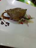 Roasted beef heart with cucumber salad and garlic soy reduc