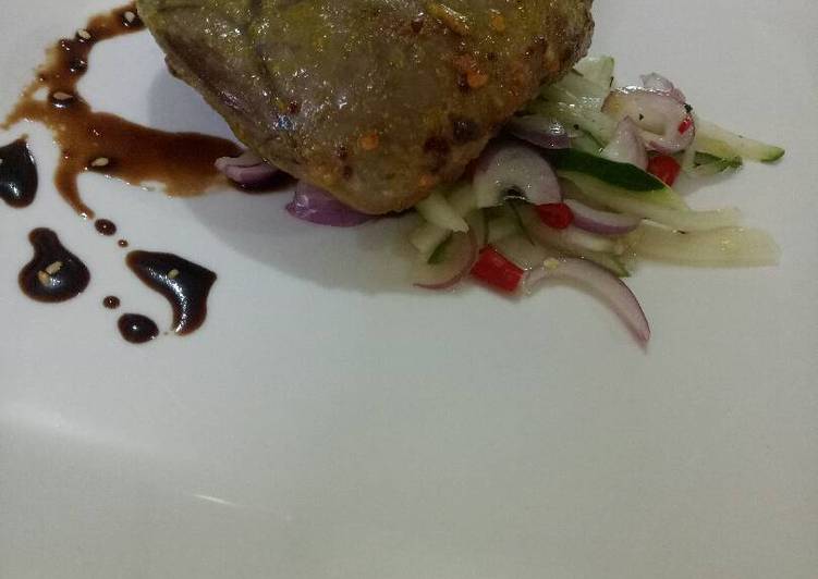 Roasted beef heart with cucumber salad and garlic soy reduc