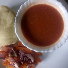 A picture of Oven baked carrot strips with smooth mashed potatoes and homemade garlic tomato sauce.