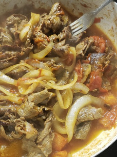 Una foto de Bistec encebollado