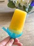 Polo de hielo de manzana y naranja
