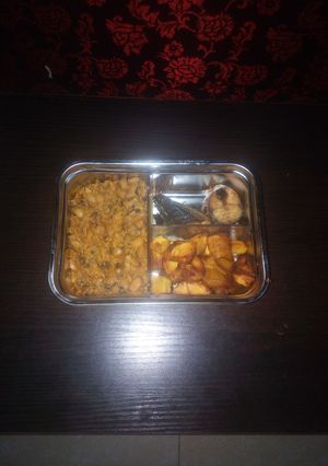 A picture of Porridge beans and diced plantain with fish.
