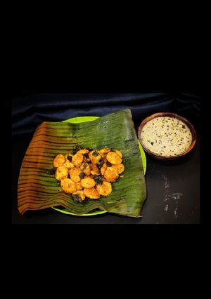 A picture of Spicy masala button idlis with chutney.