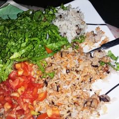A picture of Rice and beans with vegetables.