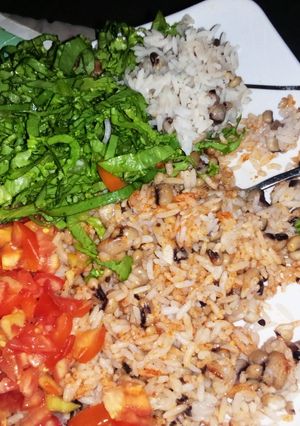 A picture of Rice and beans with vegetables.