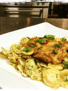 A picture of Braised Chicken, Andouille Mushroom Cream Sauce served over Orecchiette Pasta.