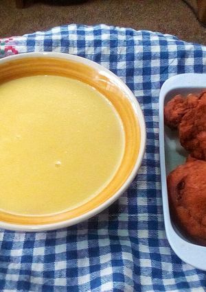 A picture of Akara and yellow pap.
