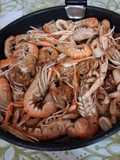Cigalas y calamares encebollados
