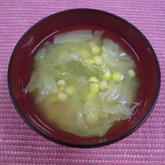 A picture of Miso soup with corn and cabbage.