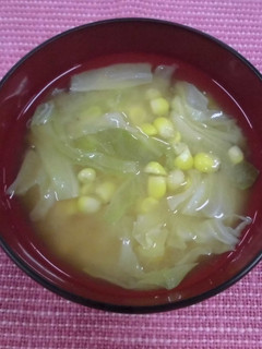 A picture of Miso soup with corn and cabbage.