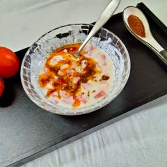 Tomato Raita seasoned with Mustard seeds A picture of Tomato Raita seasoned with Mustard seeds.