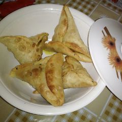 A picture of Aloo samosa without onion garlic.