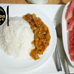 A picture of White rice with pomo sauce and watermelon.