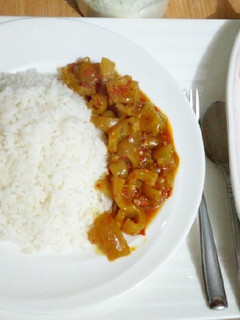 A picture of White rice with pomo sauce and watermelon.