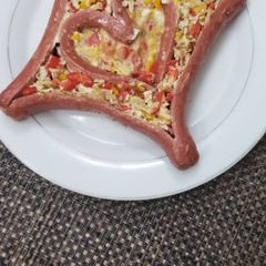 A picture of Scrambled egg with Sausage.