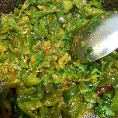 A picture of Shimla mirch with achar masala, less ingredients.