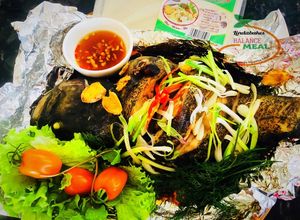 Hình của món Cá song (cá mú) nướng giấy bạc.