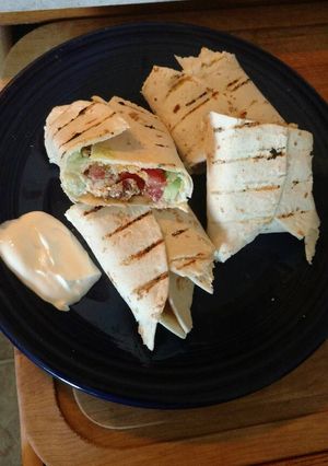 A picture of Cilantro lime chicken avocado burritos.