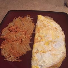 A picture of Omelette and Hash Browns.