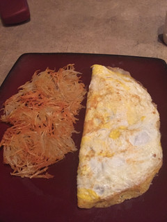 A picture of Omelette and Hash Browns.