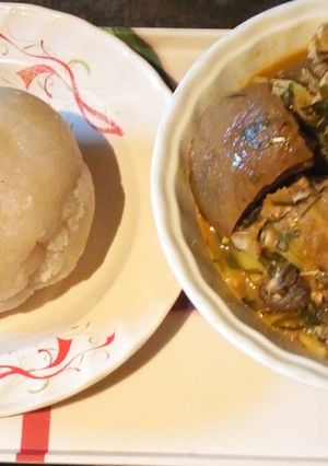 A picture of Ukazi soup with white garri.